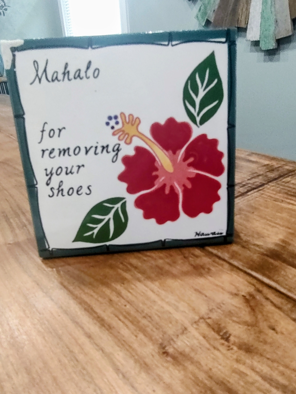 Decorative Wall Art with Red Hibiscus Design.
